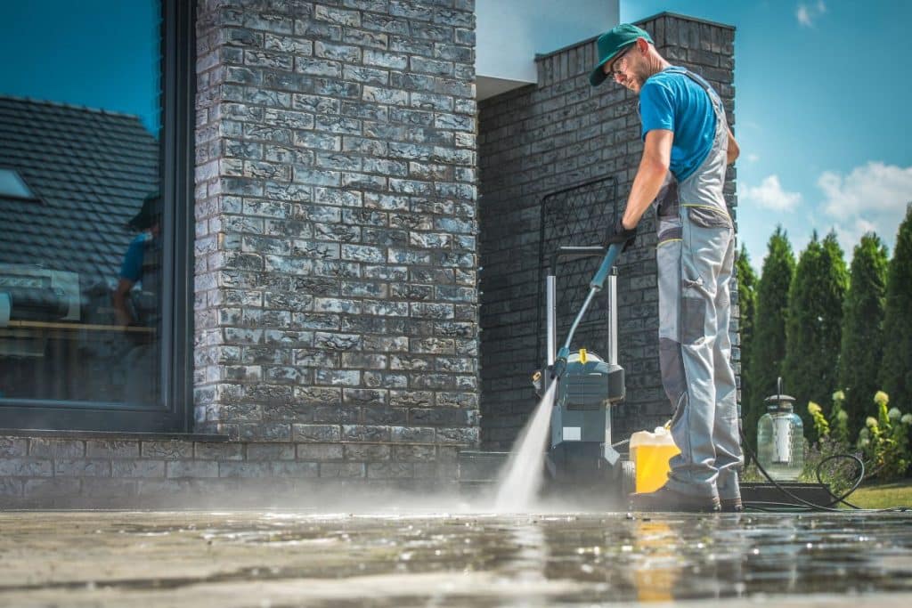Arnold Ready Mix worker washing concrete